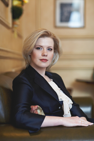 CPC OTC and Pharma Expert in Russia, Ukraine, Belarus, and Kazakhstan Elena Vatutina sitting on an executive couch