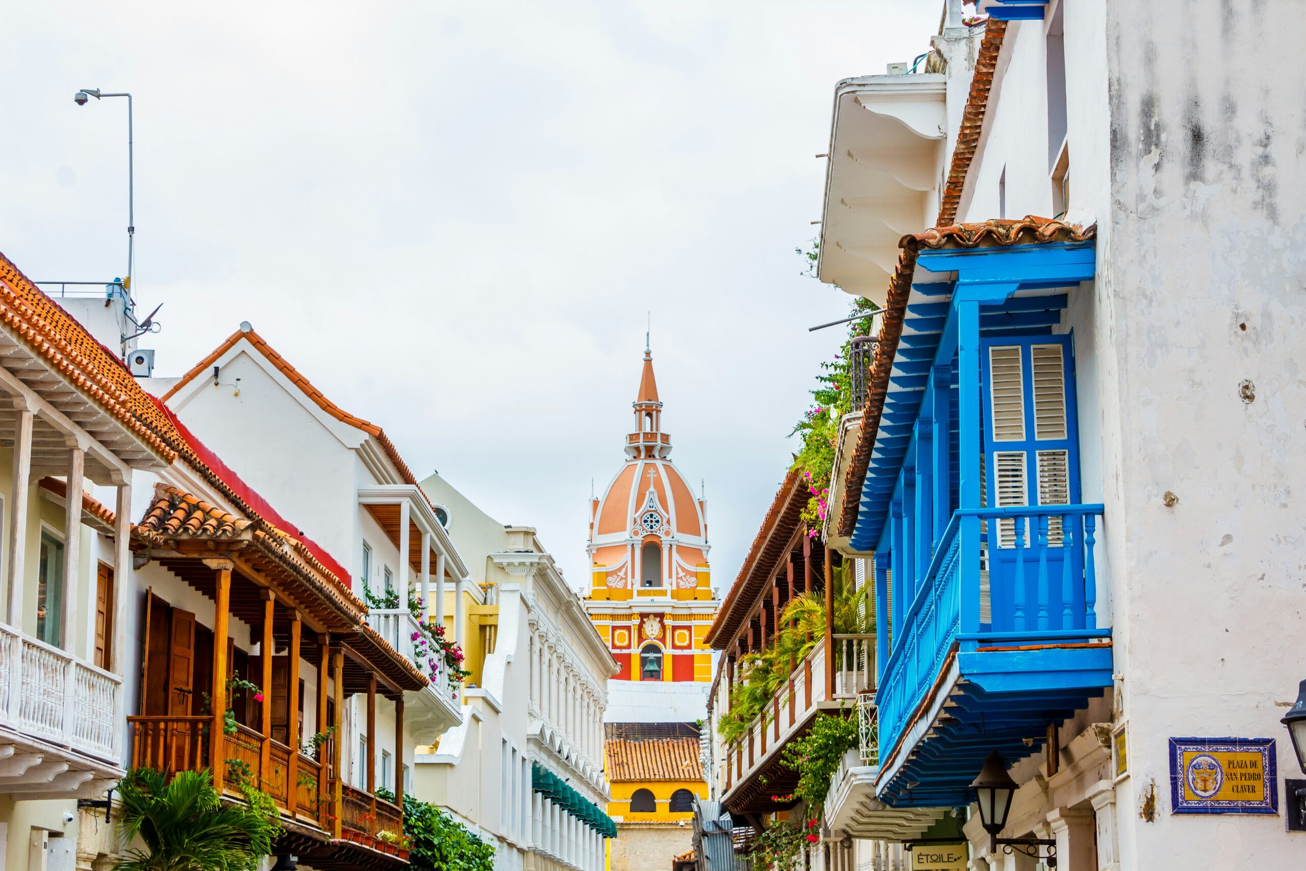a row of buildings with a steeple in Colombia