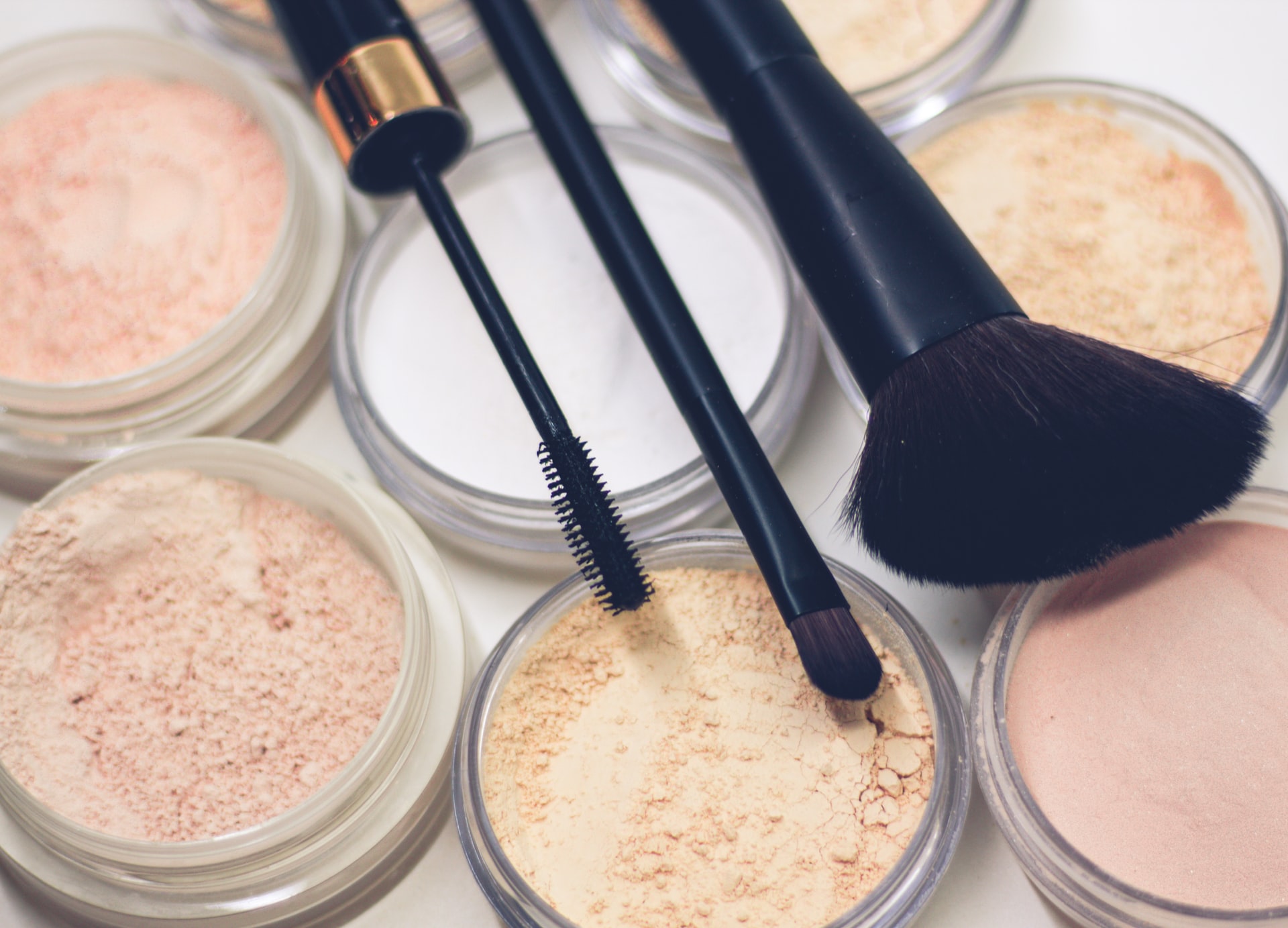 Make-up, brushes, tweazers, foundation, and mascara