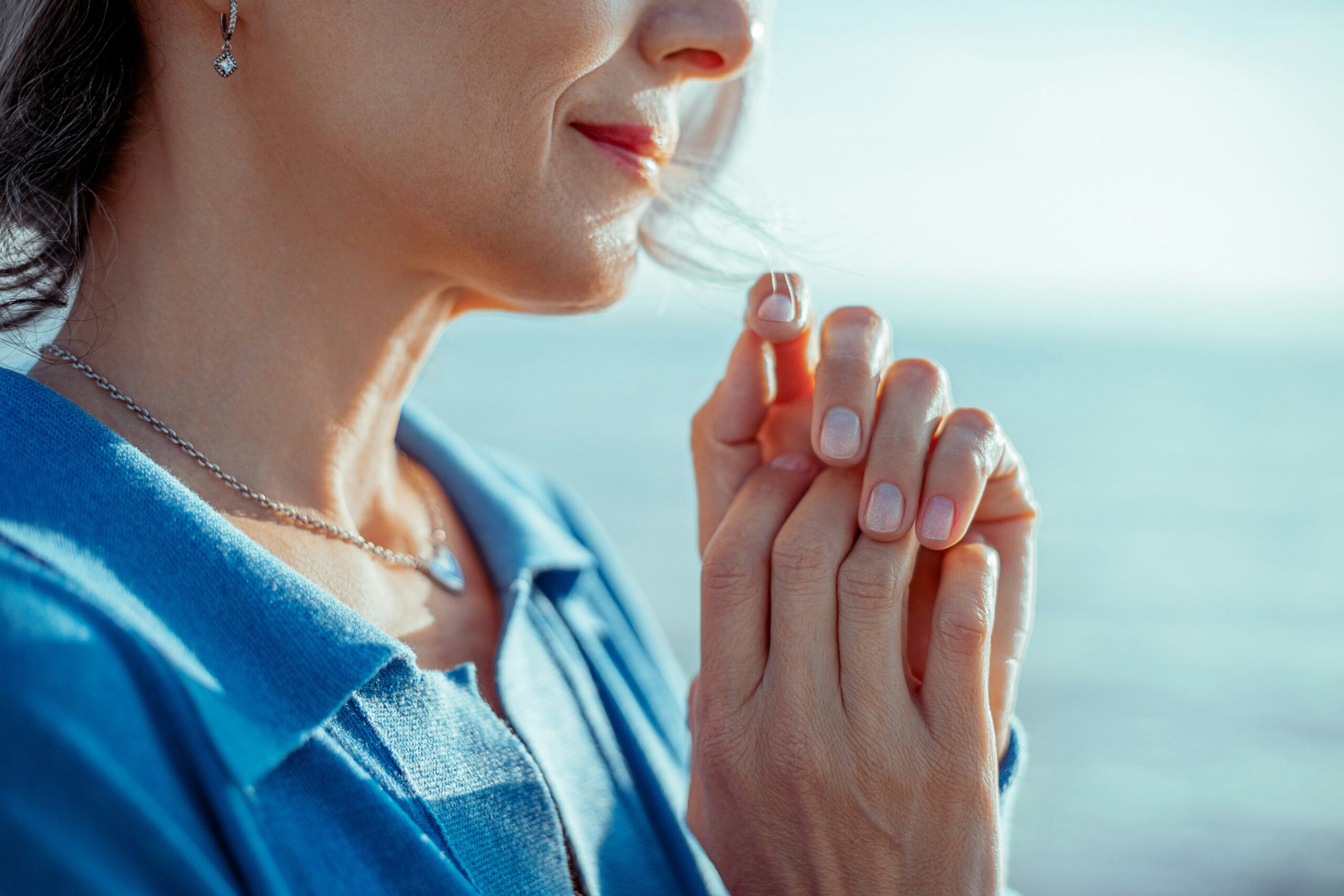 a middle aged woman by the sea