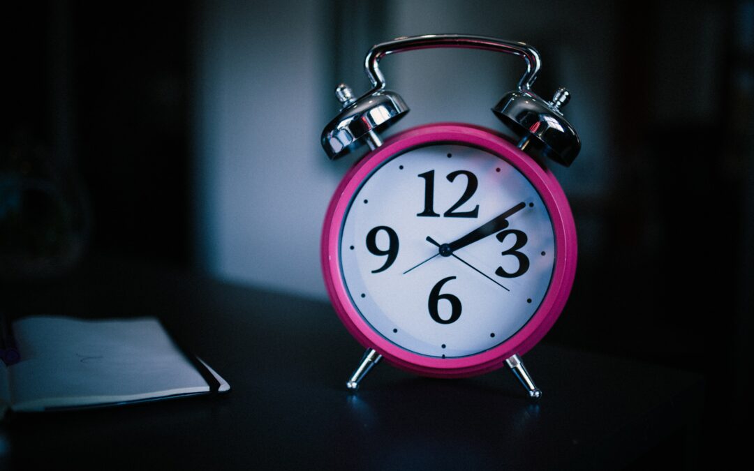 Picture of a bright pink alarm clock