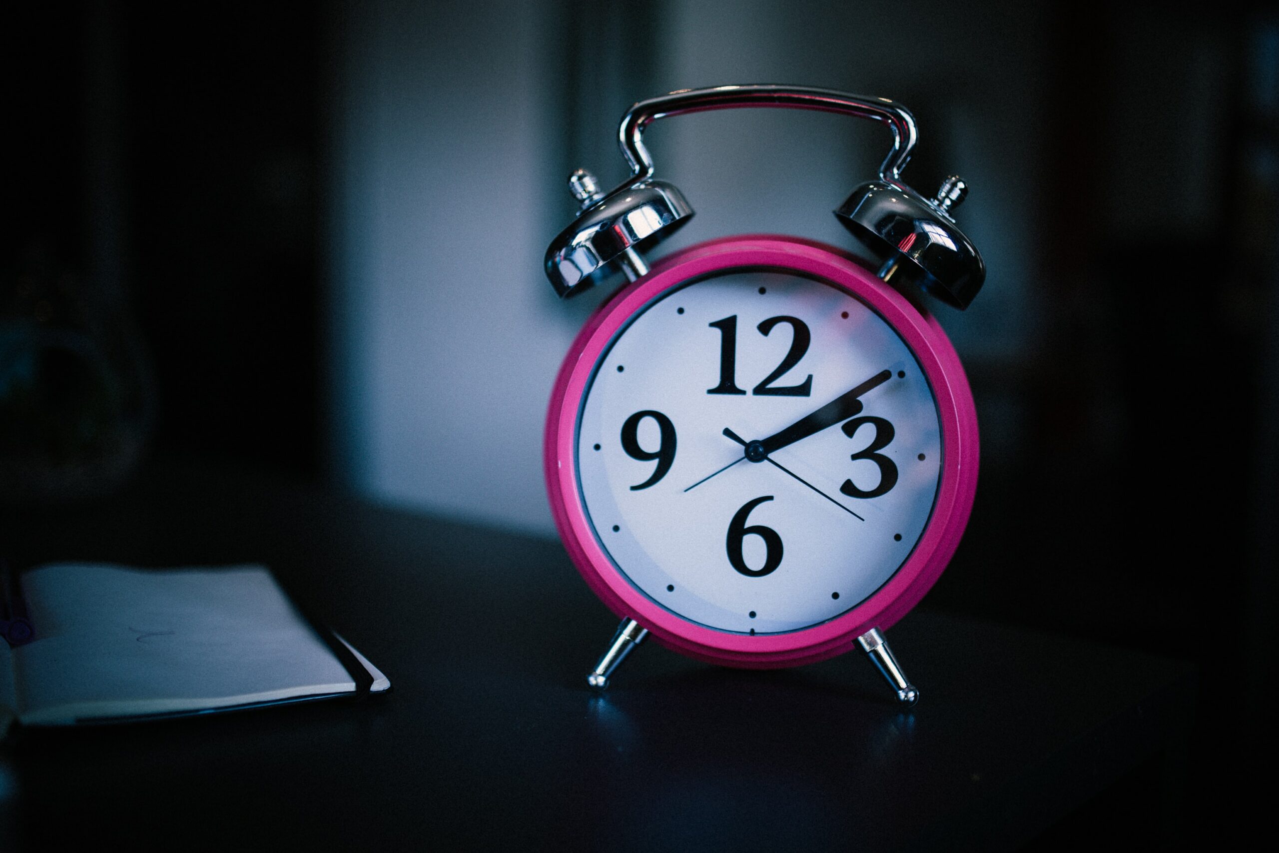 Picture of a bright pink alarm clock
