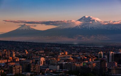 a view of a city with a mountain in the background