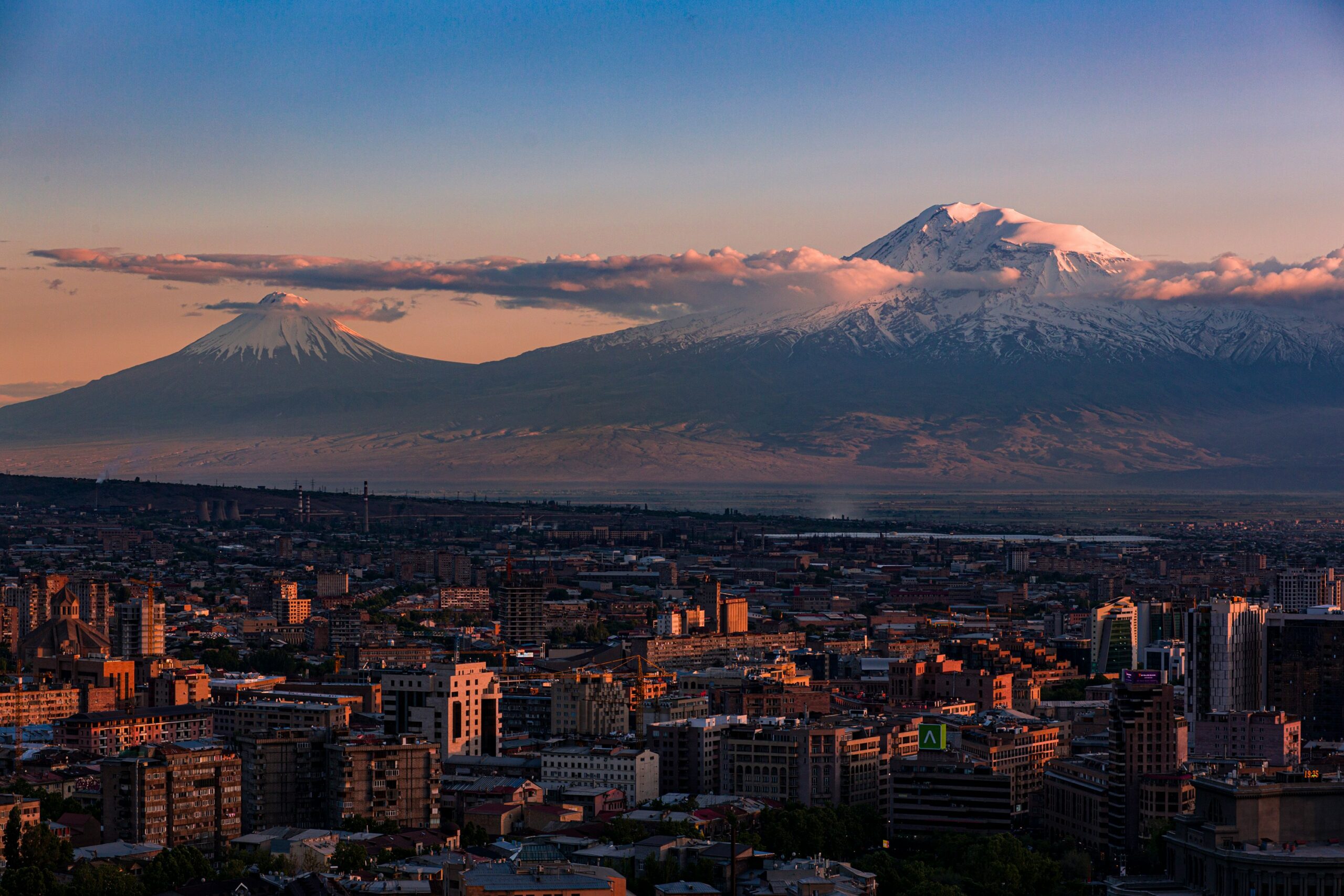 a view of a city with a mountain in the background