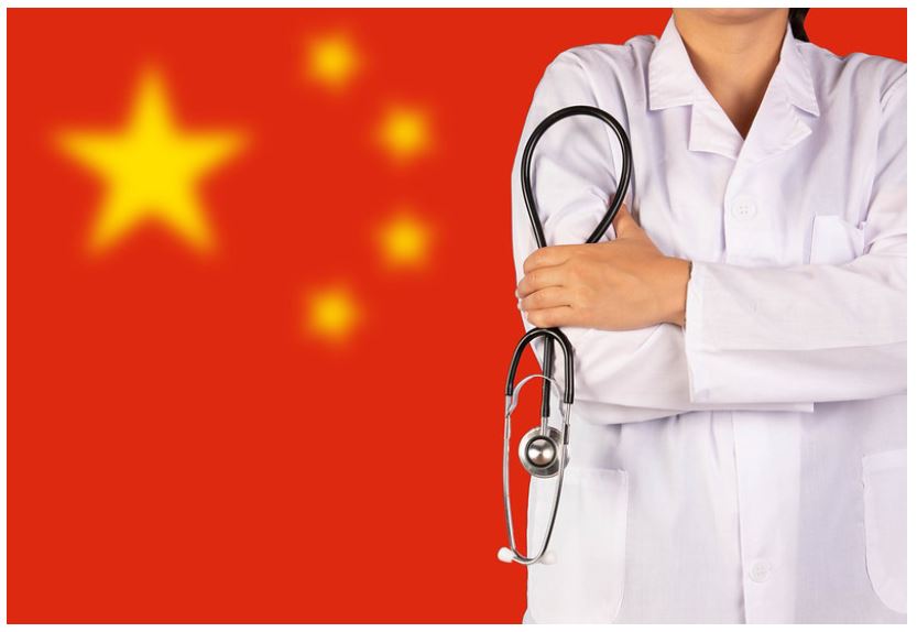Chinese doctor holding stethoscope