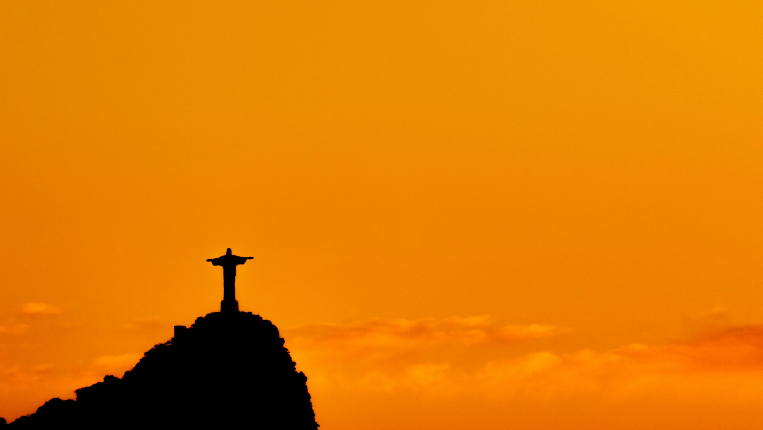 View of the Corcovado under an orange sunset