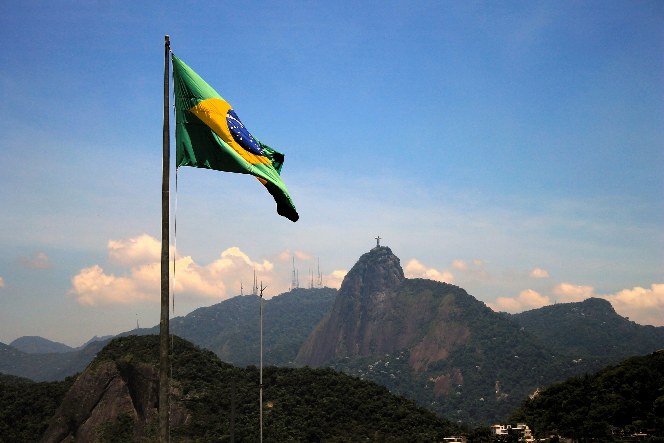Picture of Brazilian Flag with Mountains in the Background