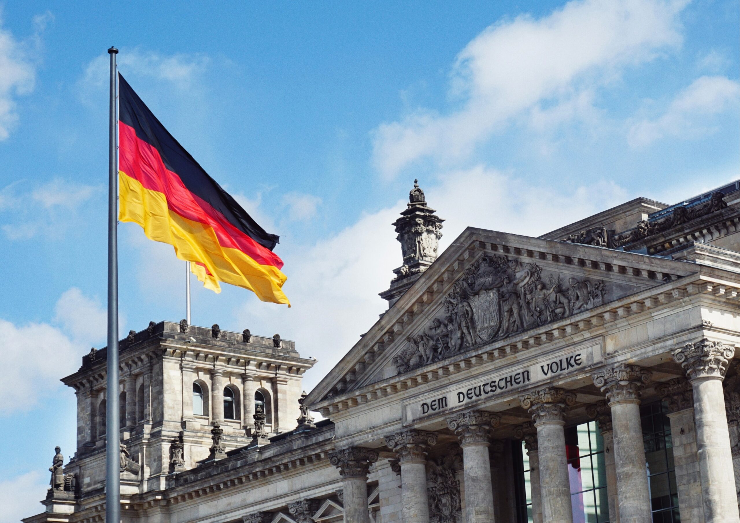 Parliament in Berlin, Germany, with the German flag in the wind