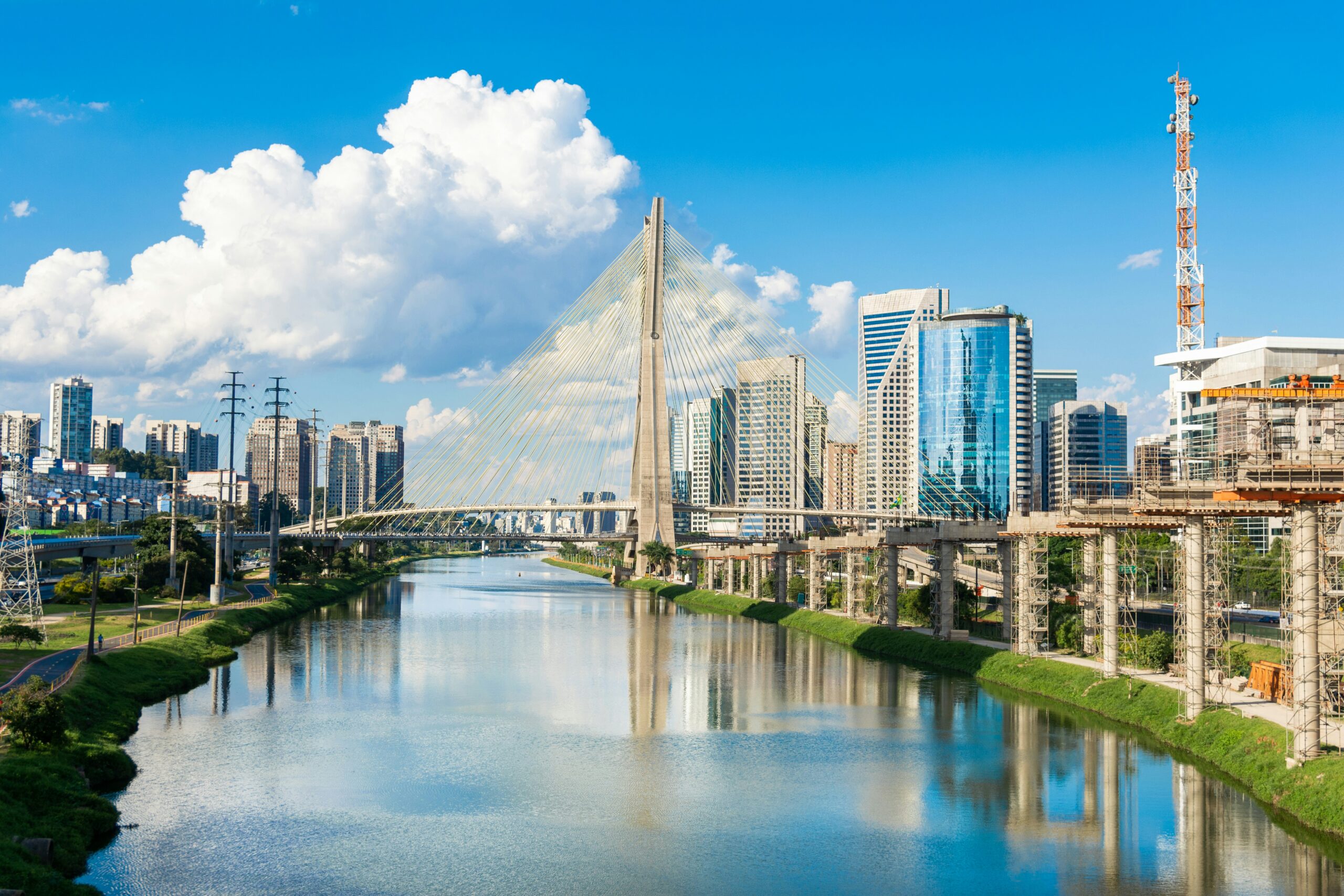Brazil Digital Pharmacy 2040: 7.24% CAGR and OTC Launch Models a river running through a city next to tall buildings Ponte Estaiada, São Paulo, Brasil